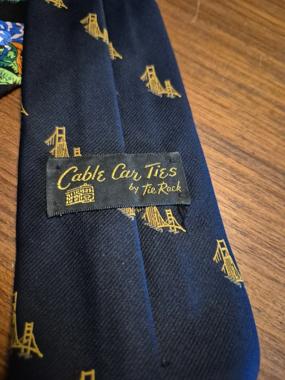 Vintage 69s Navy Tie with Gold Bridge Motif